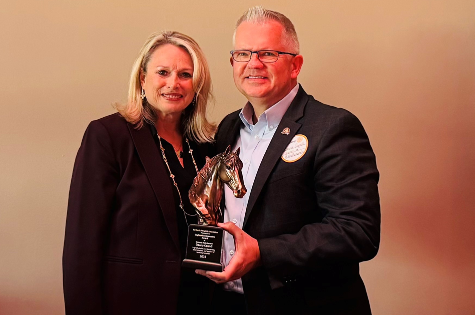 KHA President & CEO Nancy Galvagni presents the KHA Legislative Champion Award to Senator Danny Carroll.